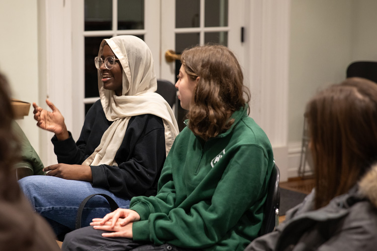 student speaking in group